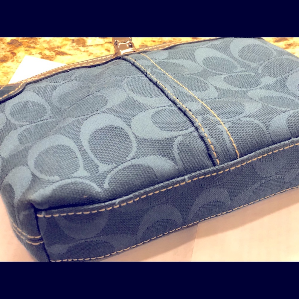 Blue gray Coach wristlet.